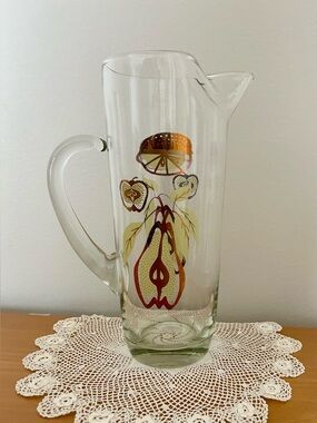 Vintage MCM clear glass pitcher with gold green brown fruit design, barware